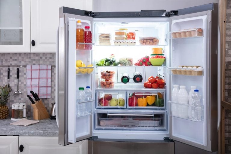 An open refrigerator filled with fresh fruits and vegetables, Can You Drill A Hole In A Refrigerator?