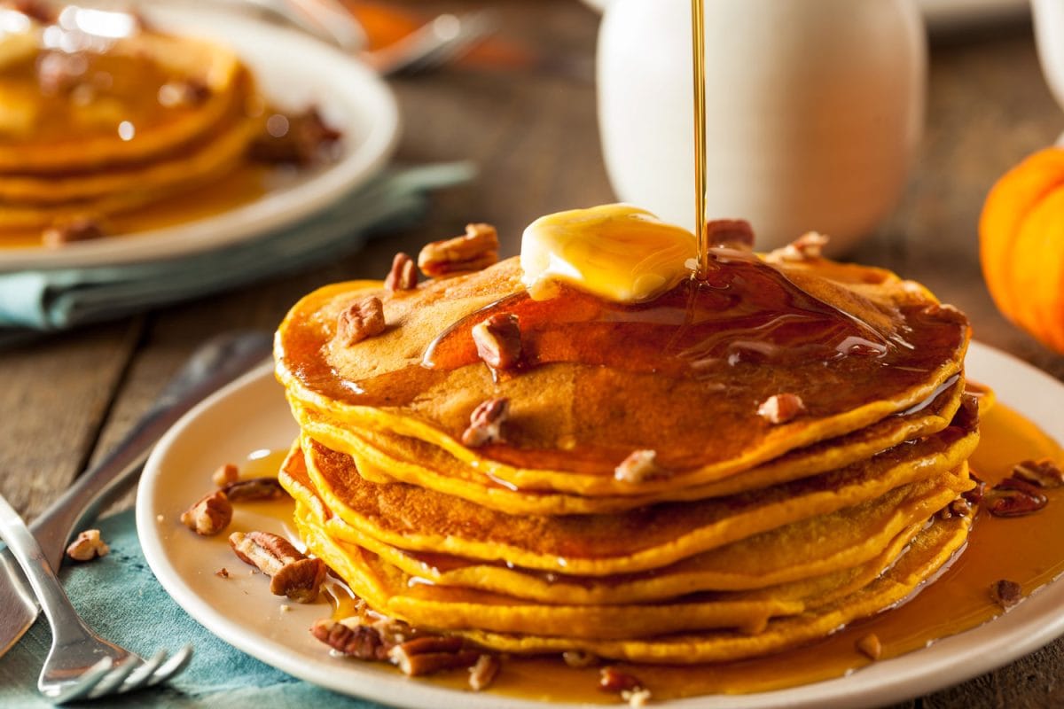 Pancakes drizzled with maple syrup