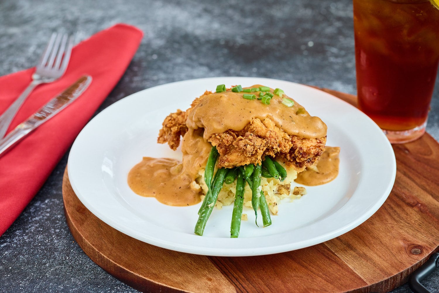 Southern Fried Chicken Marinated and hand breaded chicken breast, smothered in creole gravy.