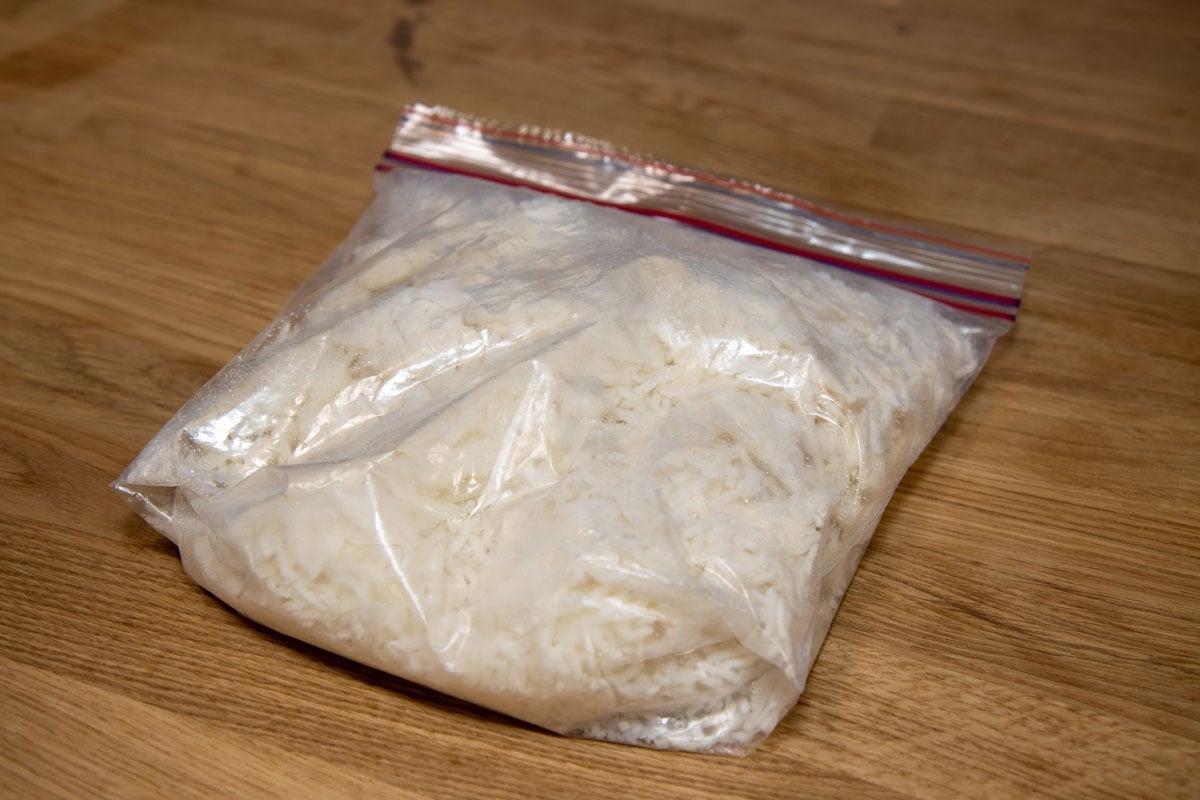 A bag of frozen rice on a wooden desk rice