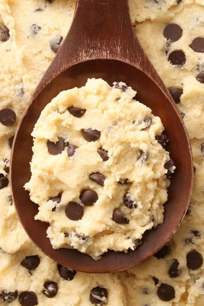 A wooden spatula scooping delicious cookie dough