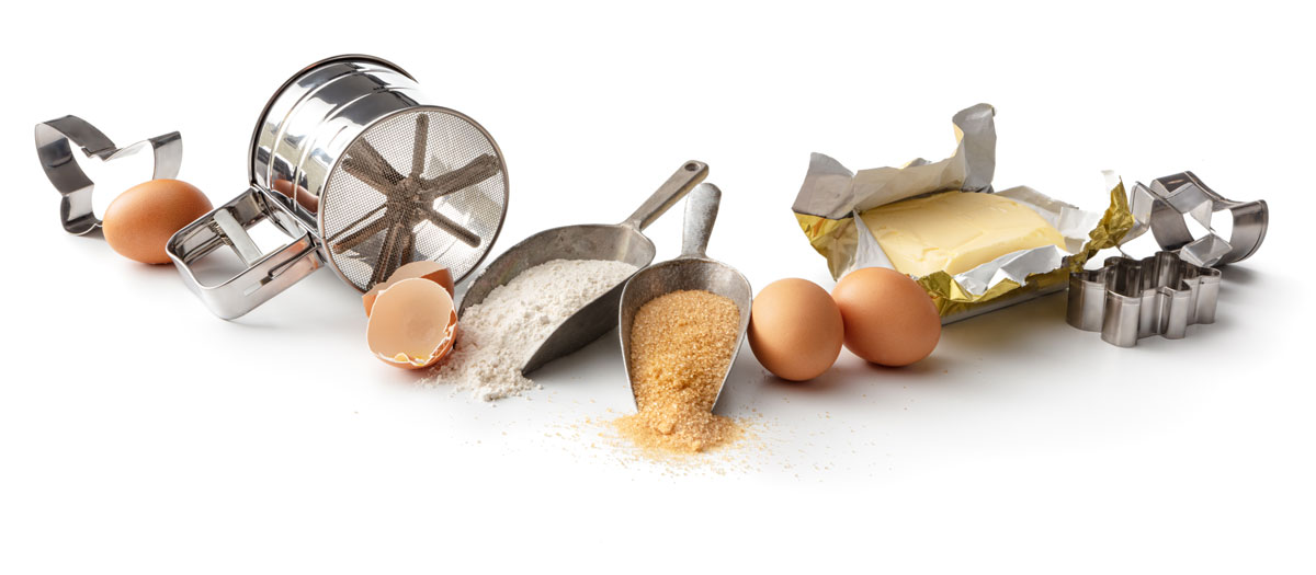 Baking utensils along with eggs and cooking powder