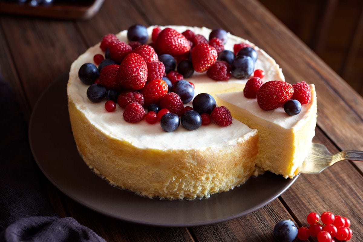 Creamy mascarpone cheese cake with strawberry and winter berries.