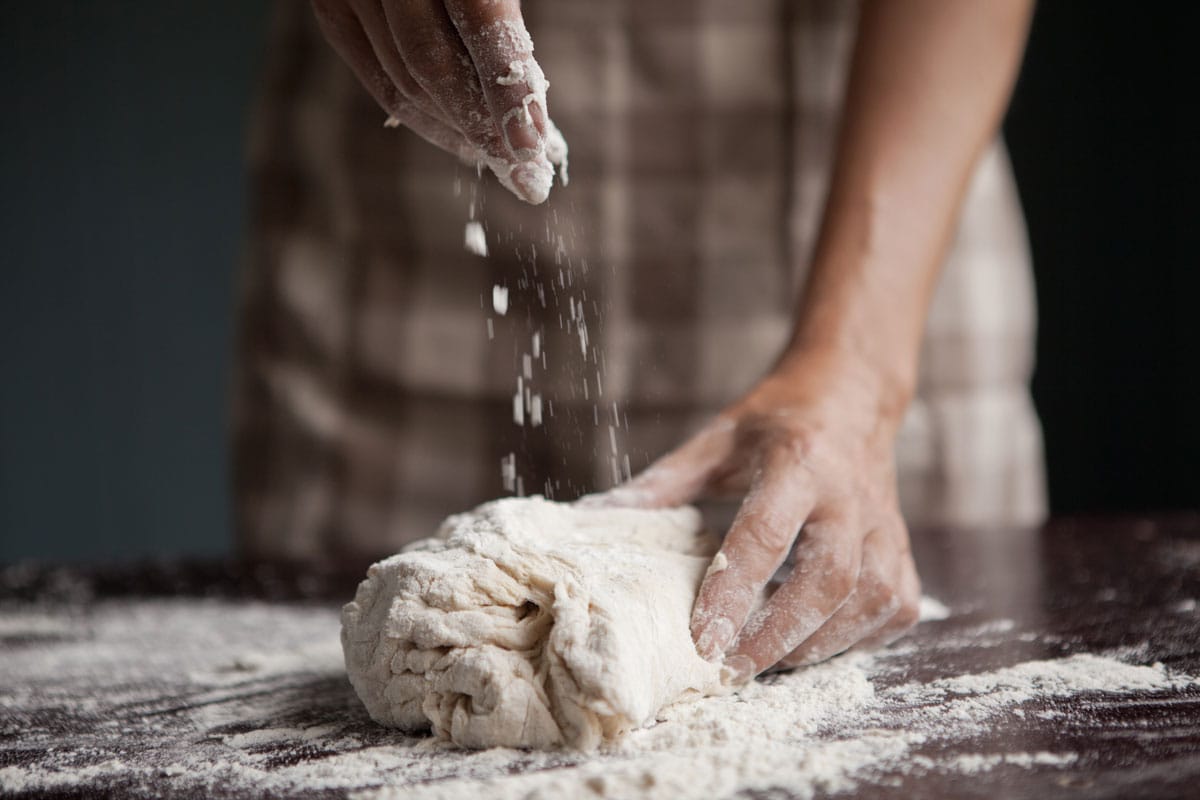 Kneading dough on the table