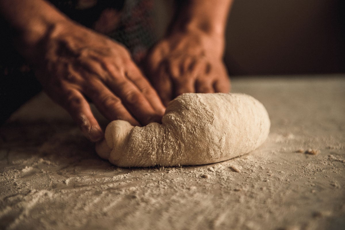 Kneading dough on the table