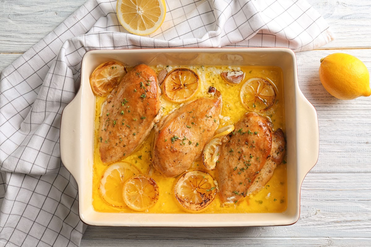 Oven baked chicken breasts with chives and lemons