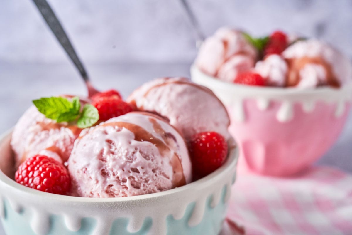 Two bowls of strawberry ice cream