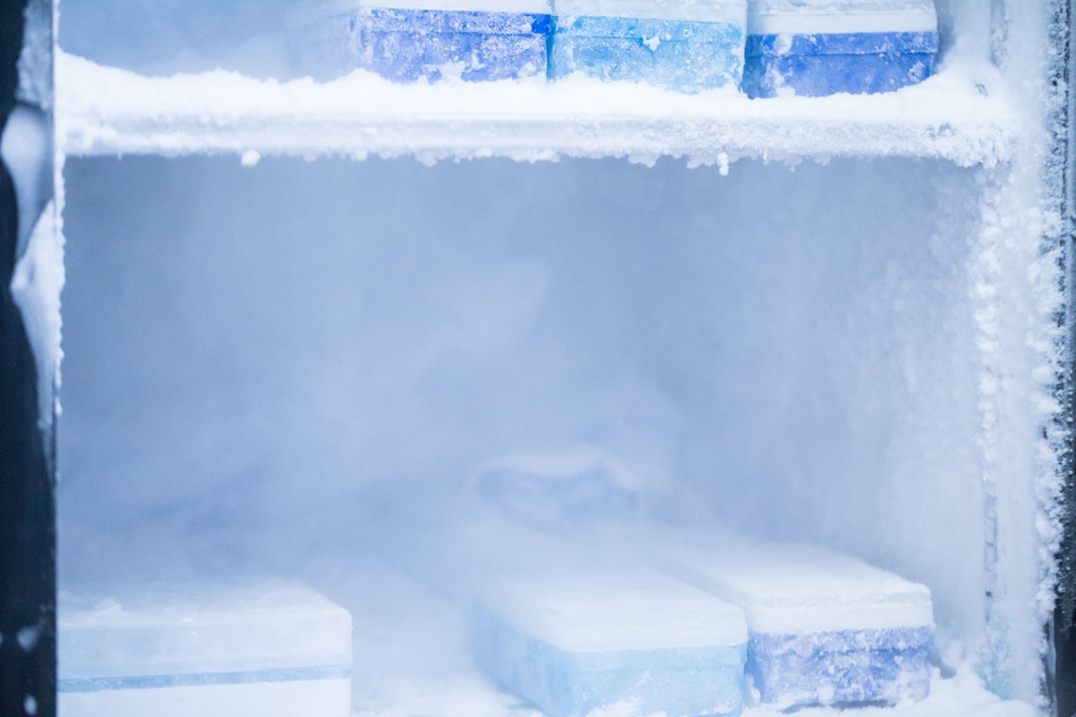 A freezer accumulating ice on the sides