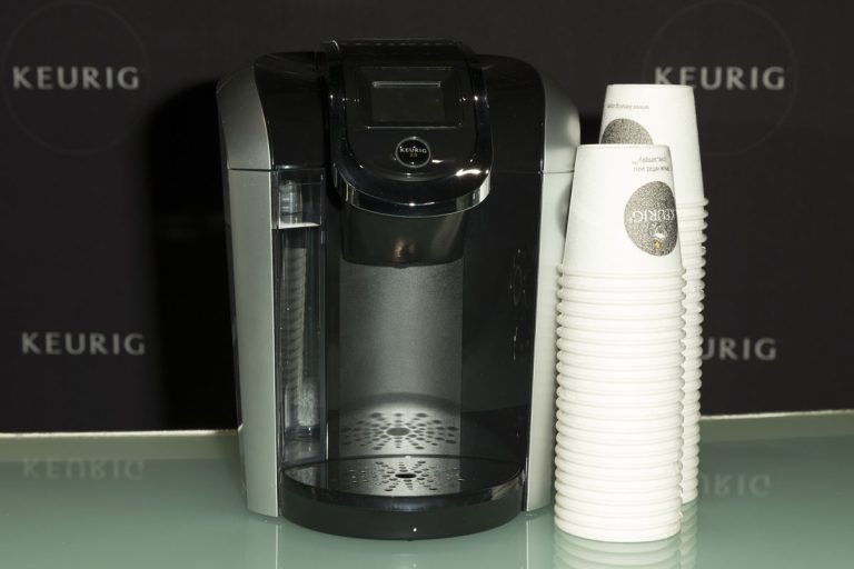 A Keurig coffee machine with coffee cups on the side, Why Does My Keurig Have A Phone Jack?
