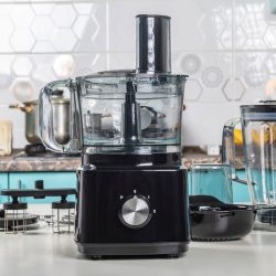 Black food processor and other accessories on it on a white countertop, How To Dice With A Kitchenaid Food Processor [In 4 Easy Steps!]