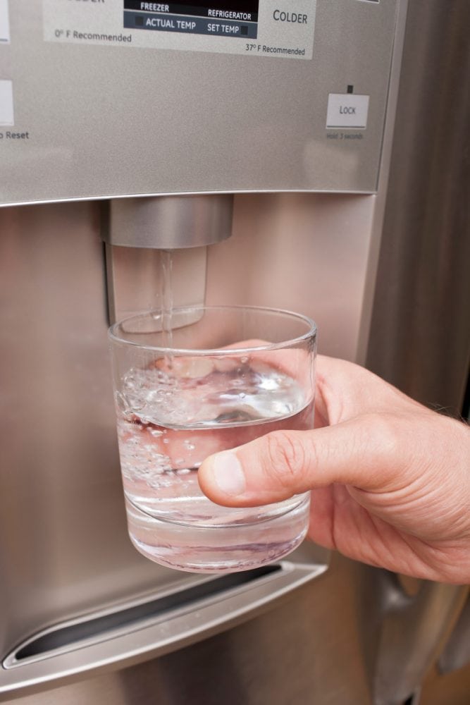 Getting a glass full of water from the refrigerator