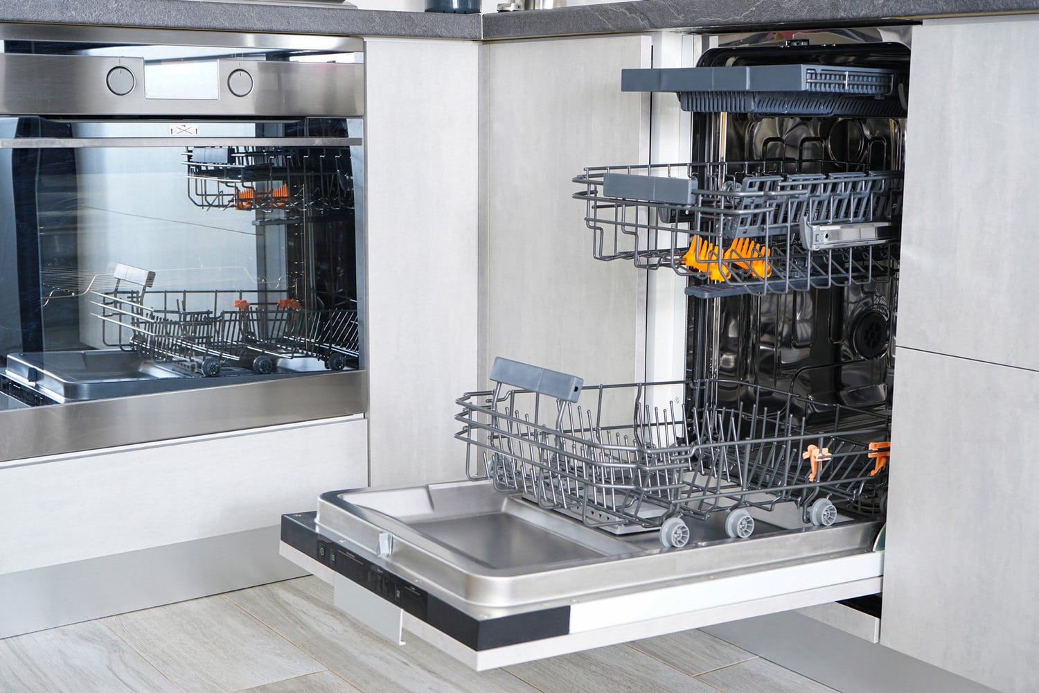 Open, empty dishwasher. Washing dishes in the dishwasher. Open automatic dishwasher.