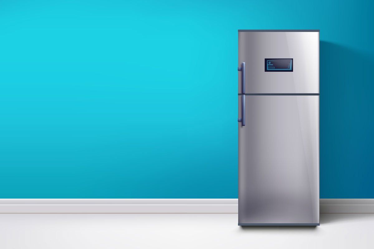 A fridge on a light blue wall