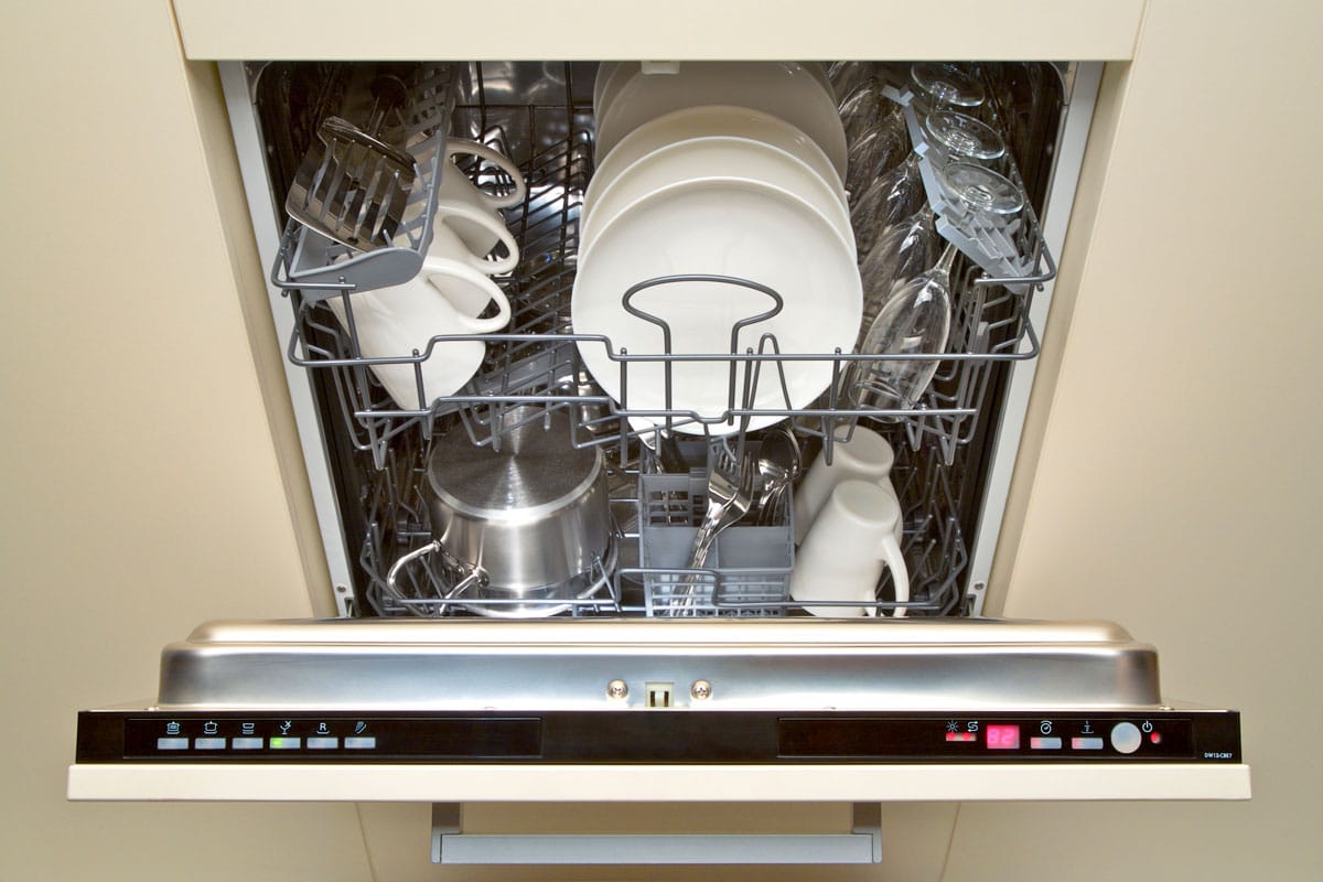 A open dishwasher with buttons in it