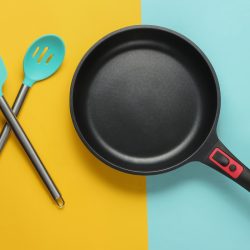 A silicone spatula and non-stick skillet, How To Remove Non-Stick Coating From A Pan [Inc. All-Clad]