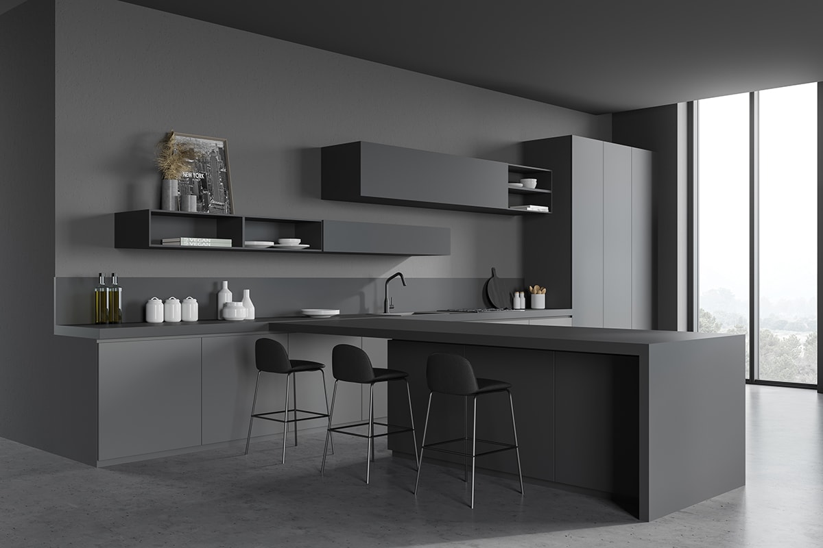 Corner of stylish kitchen grey walls, concrete floor, dark gray cupboards, countertops and bar with stools