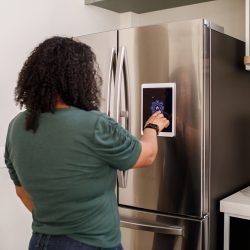 Family interacting with smart home devices on daily activities - Samsung Refrigerator Goes Into Demo Mode—What To Do