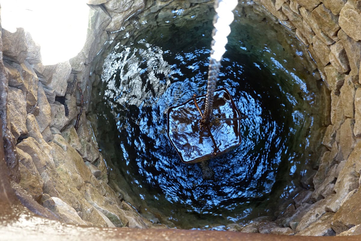 Iron bucket with water well
