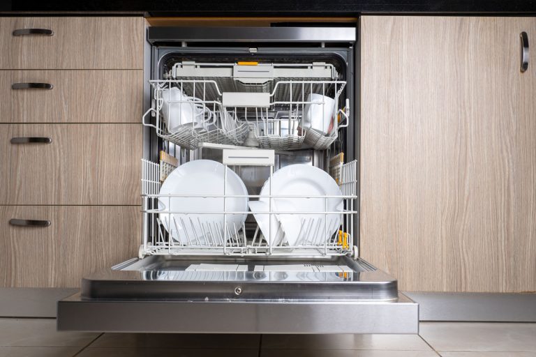 Open door of built-in dishwasher, Kitchen with integrated appliances, Plates and dishes in the dishwasher, How To Remove Top Rack Of a GE Dishwasher