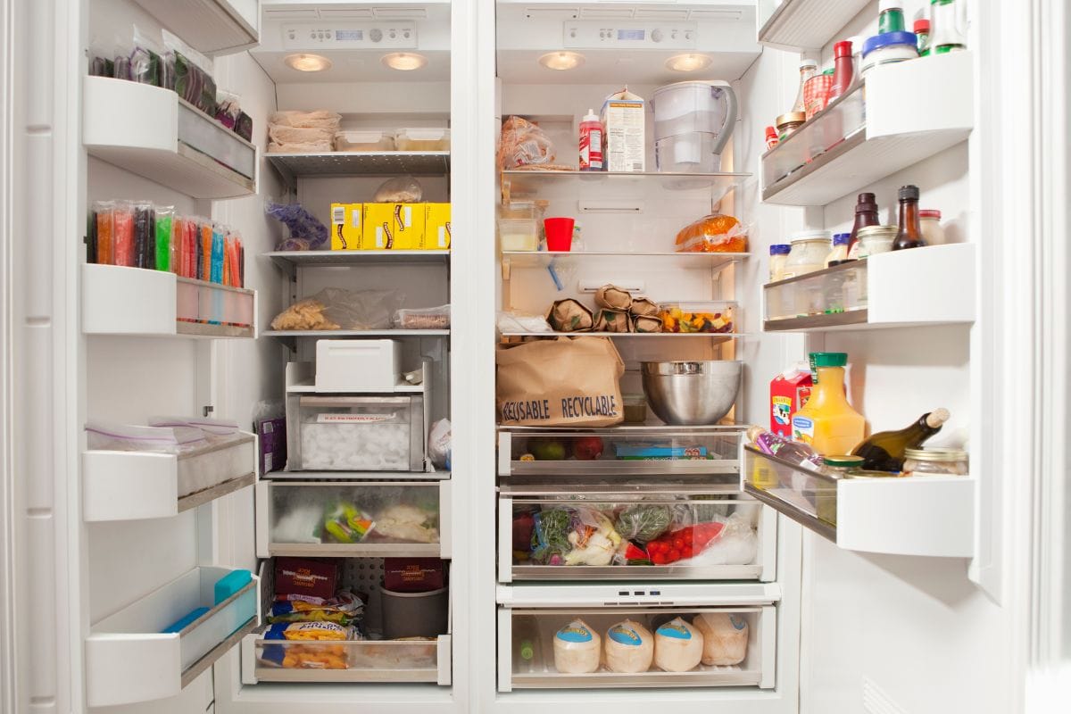 Open refrigerator with food items