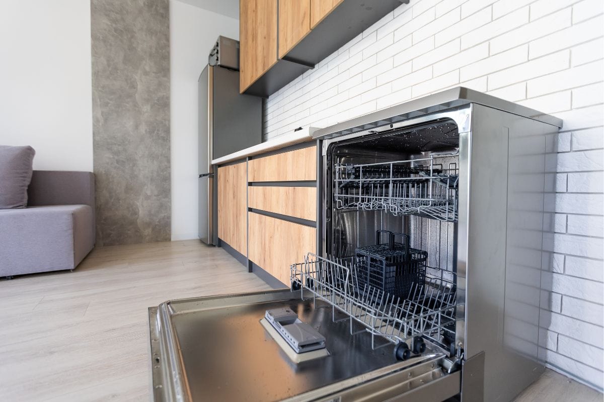 modern Half open empty dishwasher in a modern kitchen