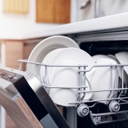 open dishwasher with clean dishes at home kitchen - KitchenAid Dishwasher Light Flashing - What To Do