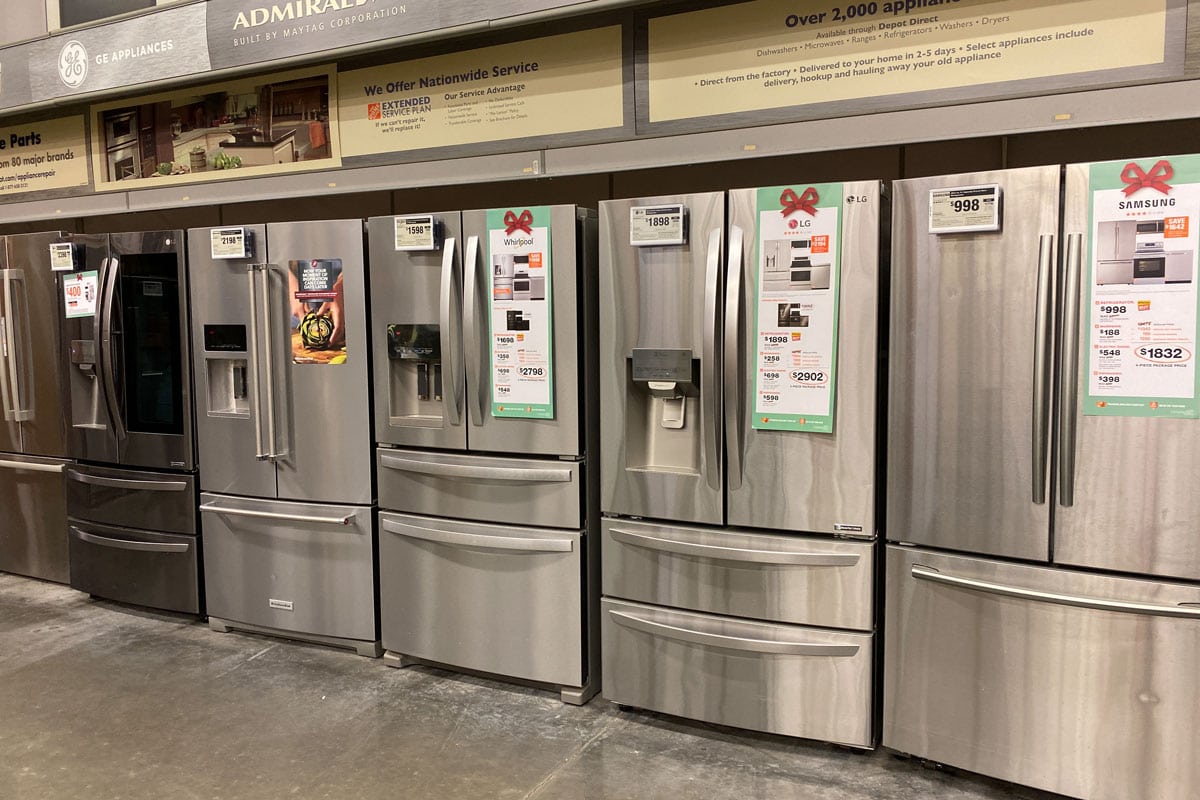 photo of a silver painted refrigerator on the display on the mall department store