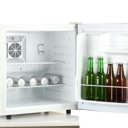 photo of a white mini refrigerator with drinks inside bottles cans, Can You Lay A Mini Fridge On Its Side?