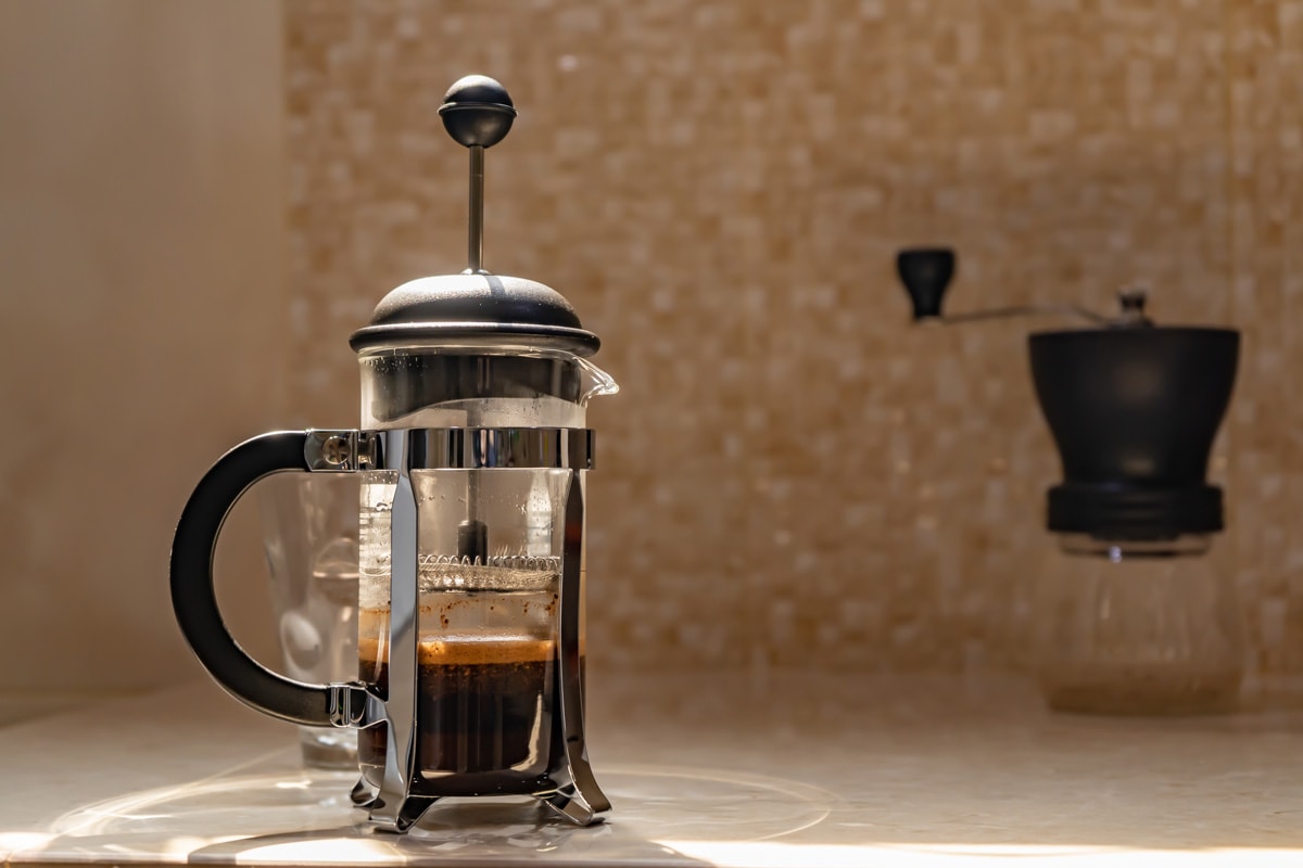 A French press on top of the kitchen counter