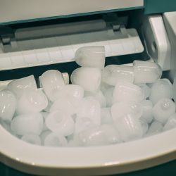 Cones of ice inside a portable ice maker, Which Portable Ice Makers Are Made In The USA? [Inc. 5 Great Options]