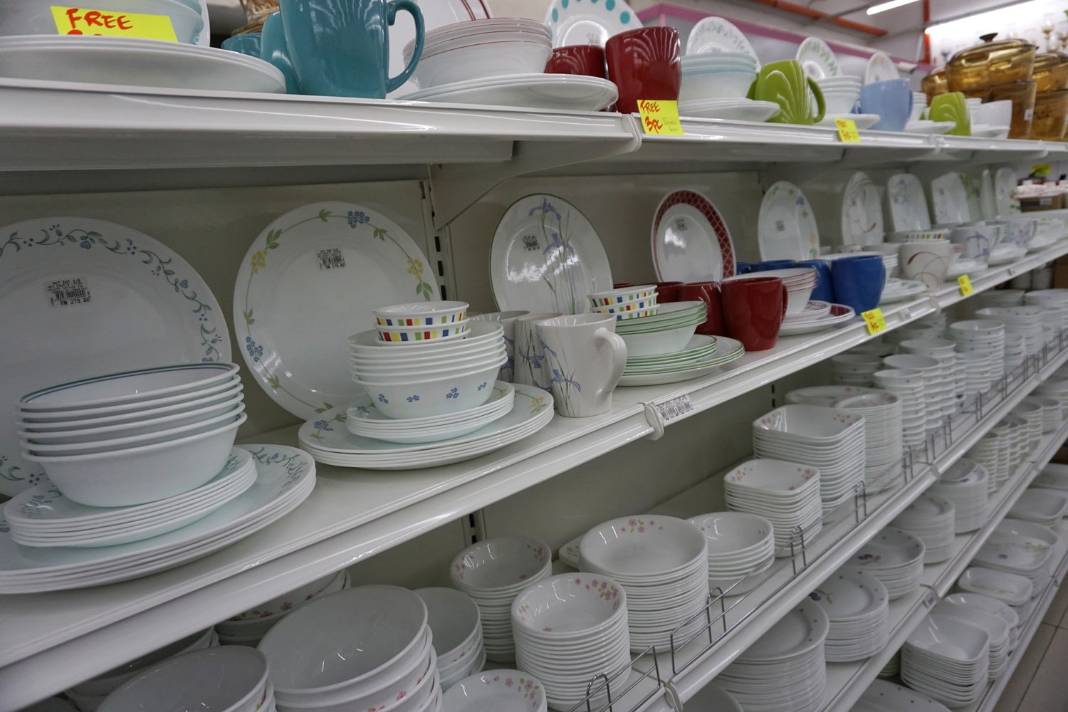 Dinnerware set Corelle brand pots, plates and cups on store shelves