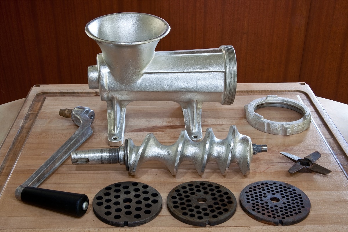 Disassemble The Meat Grinder - A standard meat grinder disassembled into its component pieces