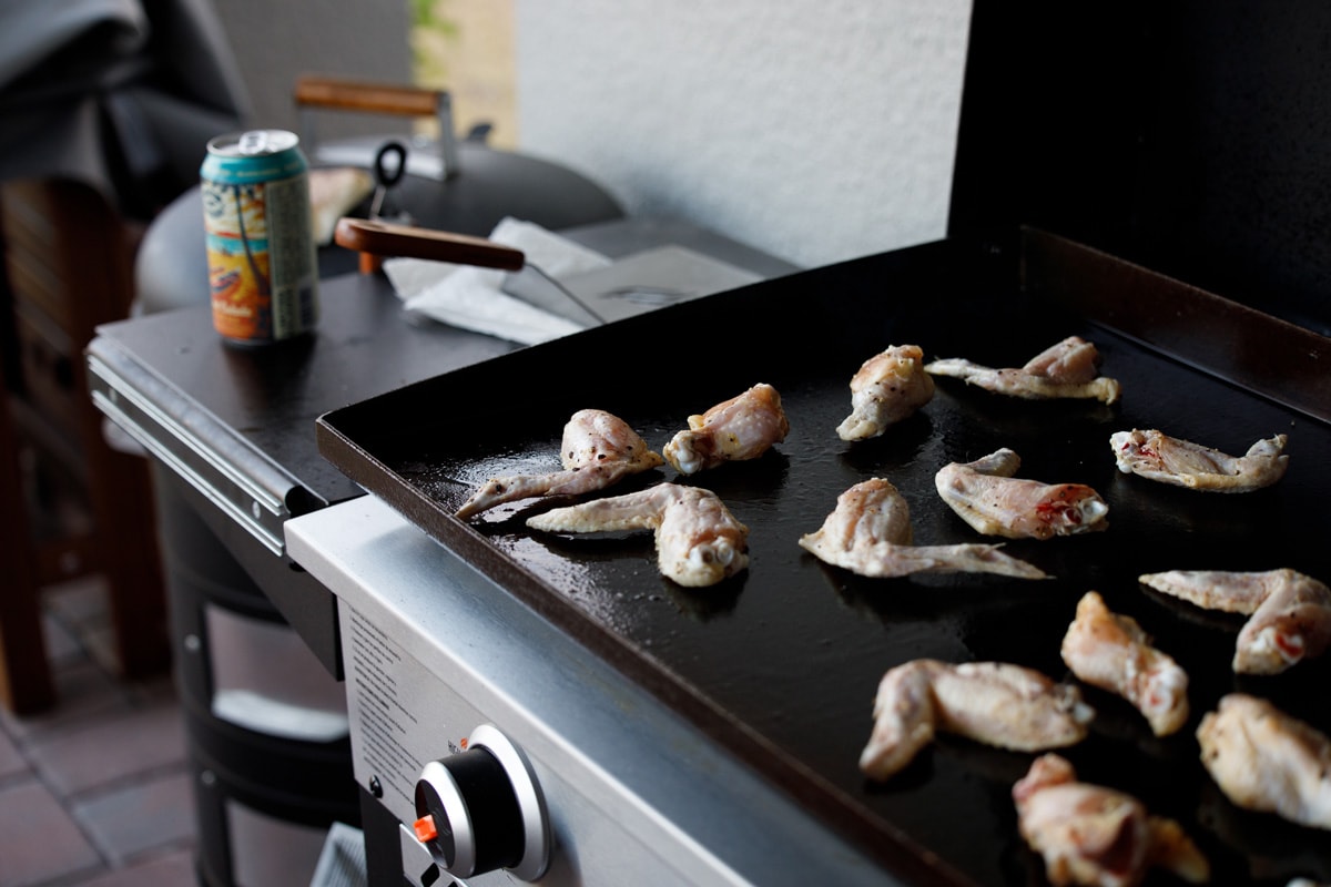 Frying delicious chicken wings on Blackstone griddle
