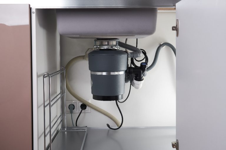 A garbage disposal under the modern sink, Garbage Disposal Won't Turn On - What To Do?