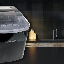 Close up of empty black kitchen counter on blurry interior background. Igloo Countertop Ice Maker All Lights Flashing - Why And What To Do?