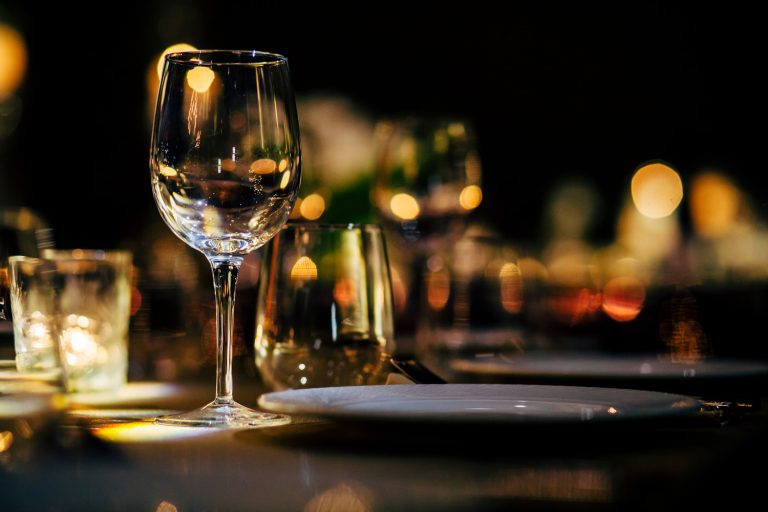 Luxury table settings for fine dining with and glassware, beautiful blurred background. For events, weddings. Preparation for holiday Christmas and Hanukkah dinner night. props for weddings, birthd