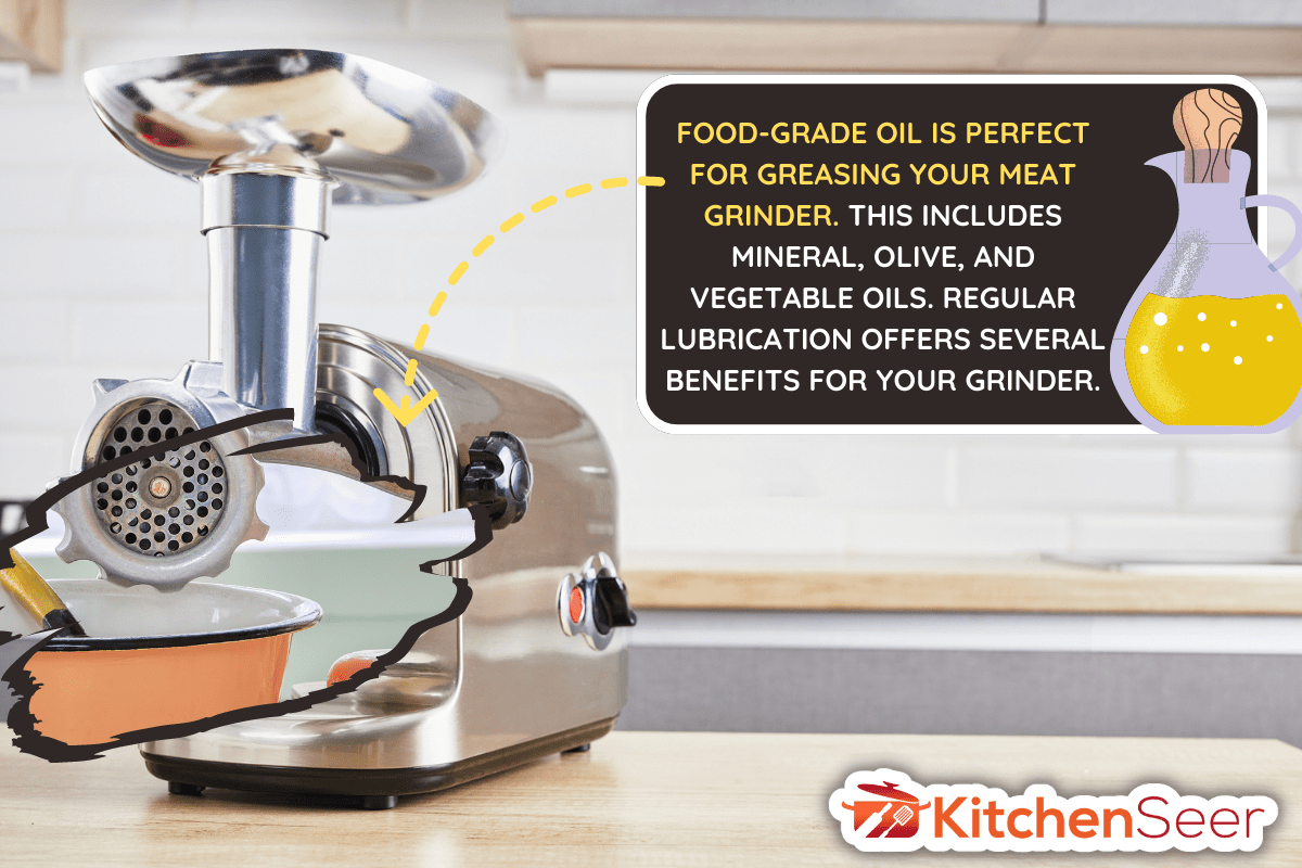 Meat grinder for fresh meat on a wooden table in kitchen interior. - What Kind Of Oil Should You Use In A Meat Grinder
