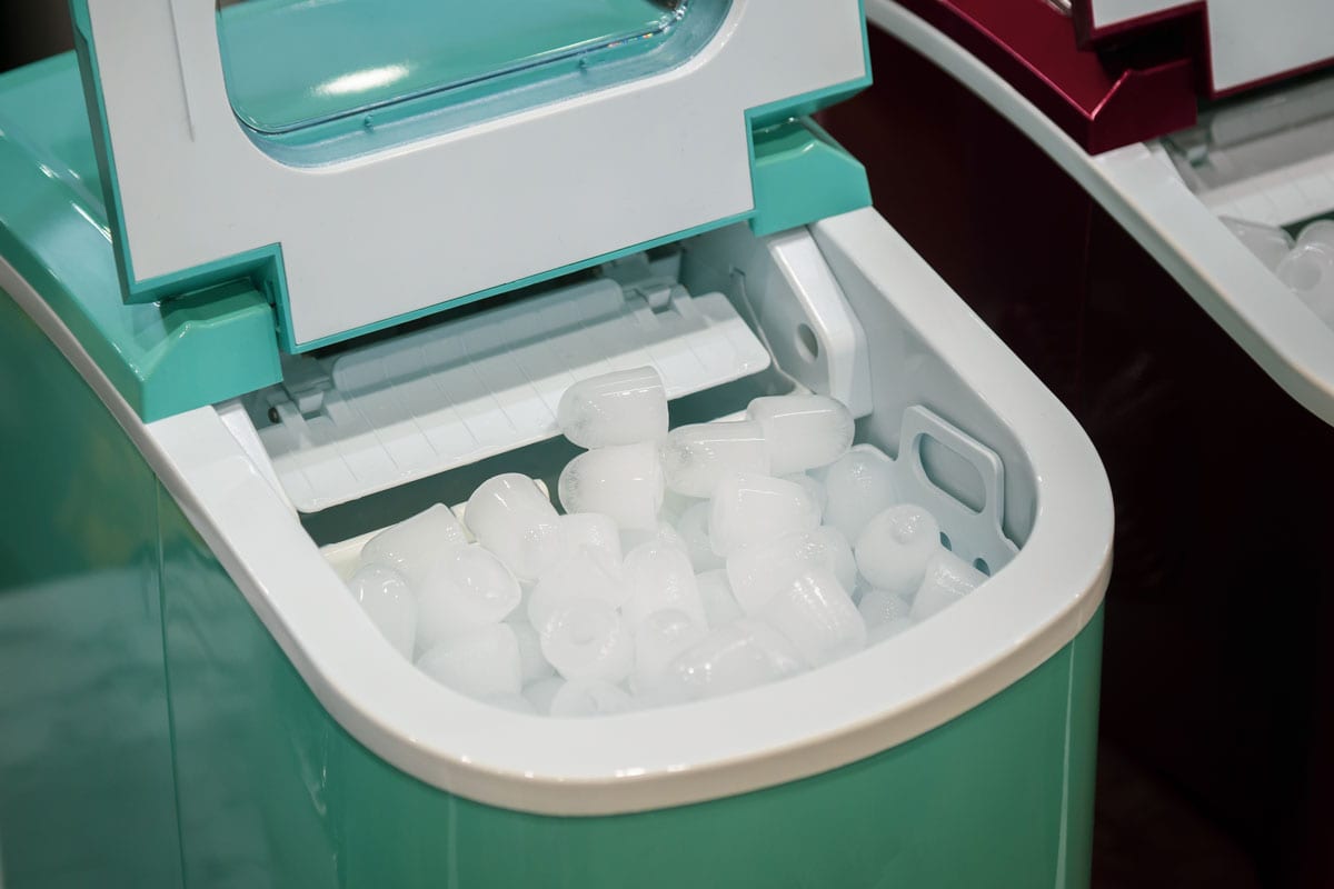 Mint green portable ice maker fully loaded with ice
