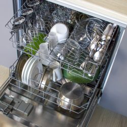 Open door of the built-in dishwasher with clean dishes inside., Kitchenaid Dishwasher Beeping But Not Starting - What's Wrong?