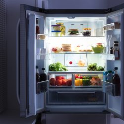An open refrigerator full of juice and fresh vegetables in kitchen, Fridge Sounds Like Running Water Gurgling