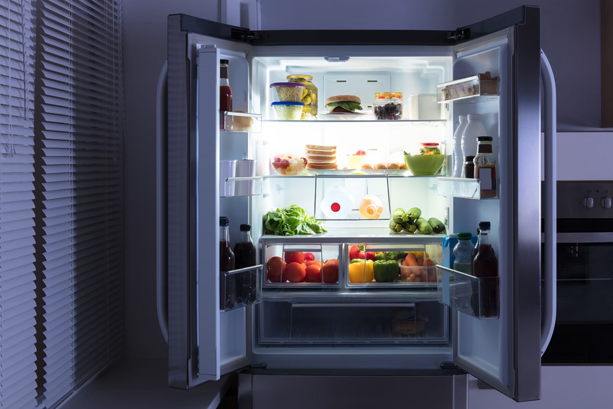 An open refrigerator full of juice and fresh vegetables in kitchen, Fridge Sounds Like Running Water Gurgling
