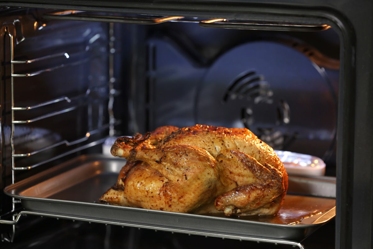 Oven roasting a turkey in the oven