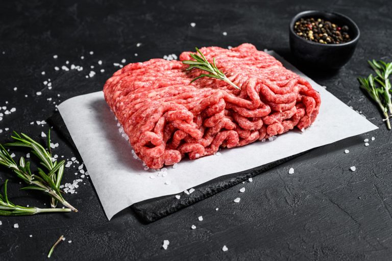 Raw minced pork sprinkled with salt all over and put over a white paper,Why Is My Ground Beef Chewy? [Does That Mean It Is Bad?]