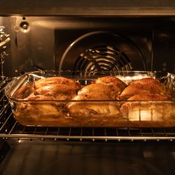 Chicken thighs baked in the oven in glass pan. Homemade food - Do You Need To Flip Chicken In The Oven
