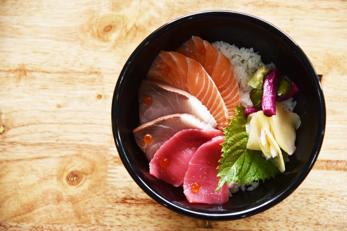 Chirashi don. Japanese food mixed sashimi rice bowl.