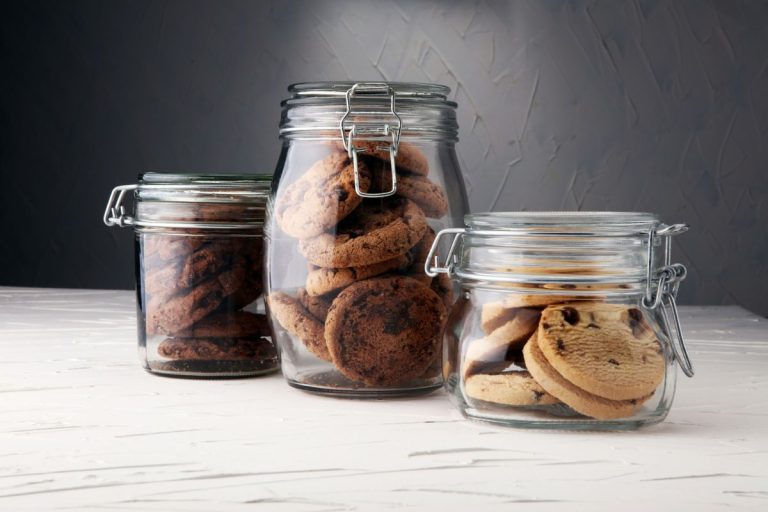 Chocolate cookies in a glass jar on white background, Should Cookies Be Refrigerated?