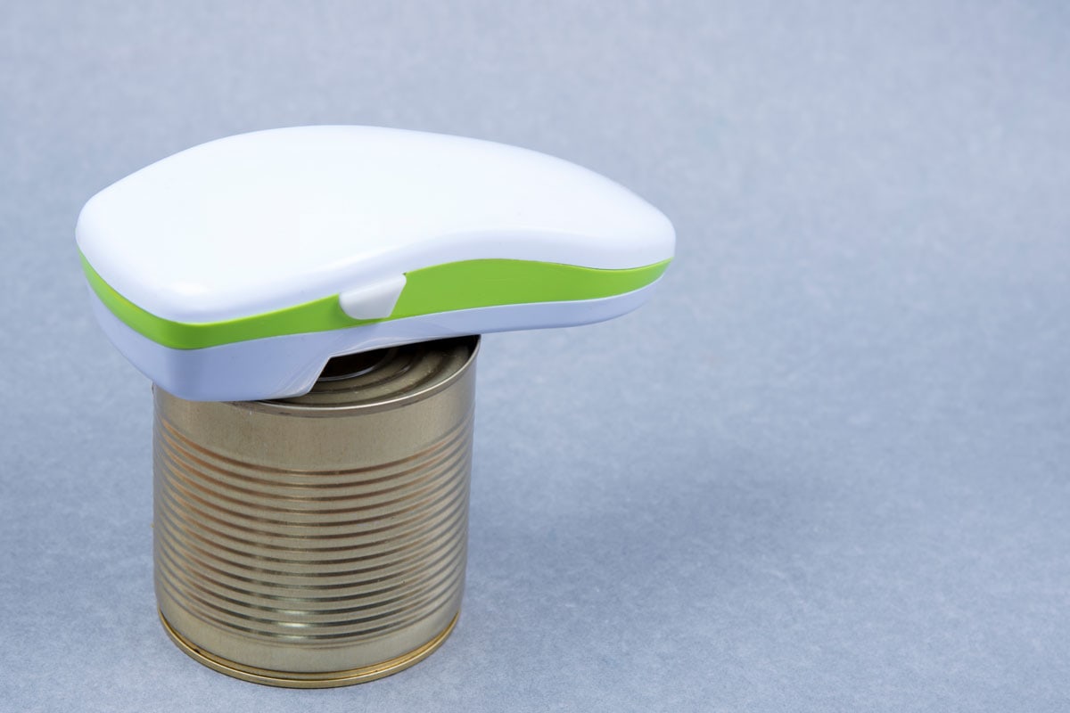 Electric can food opener white and green color in the top of the can good