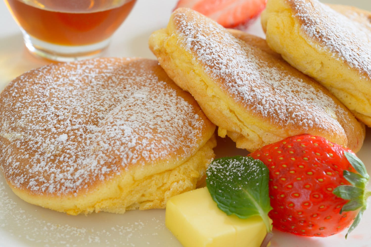 Japanese Souffle Pancake with butter and strawberries