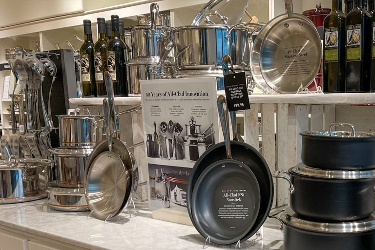 A Nonstick All Clad pot and pan aisle at a Williams Sonoma store, Are All-Clad Pans Teflon Free? [A Complete Guide]
