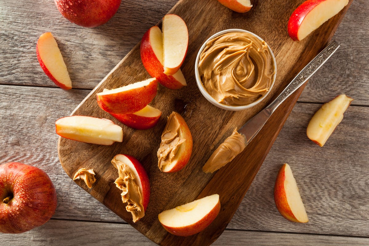 Organic Apples and Peanut Butter to Snack